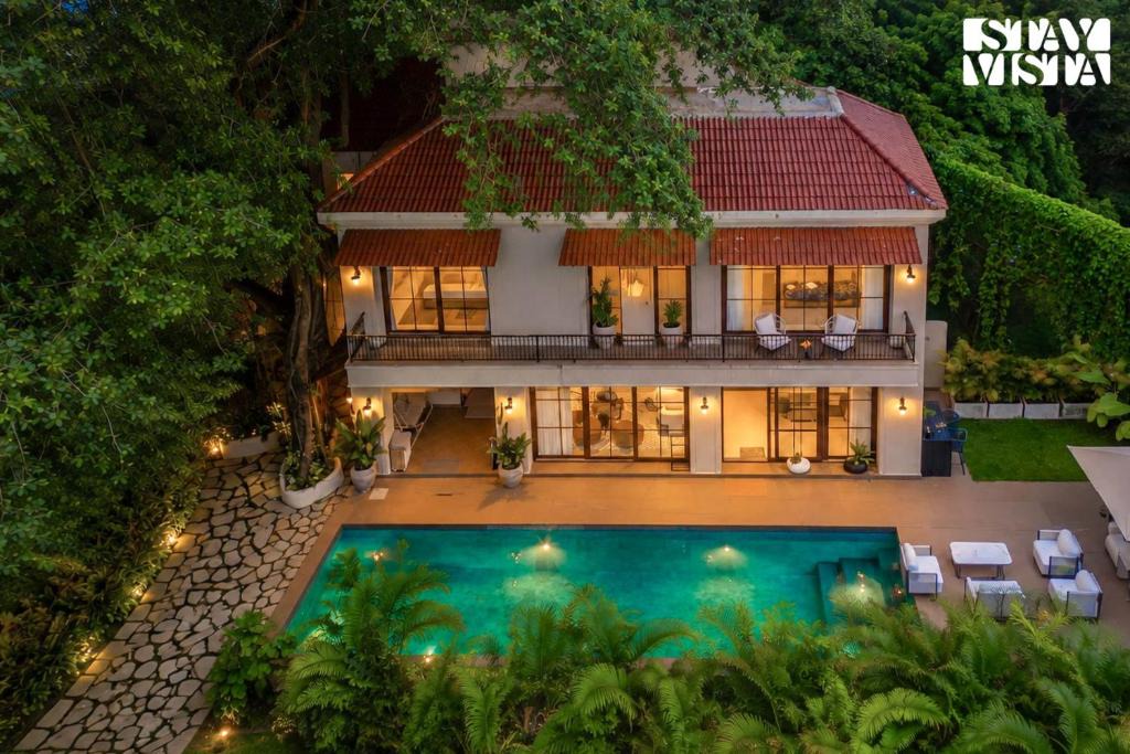 Guirim Villa | StayVista at Villa De Amara - Outdoor Pool & BBQ