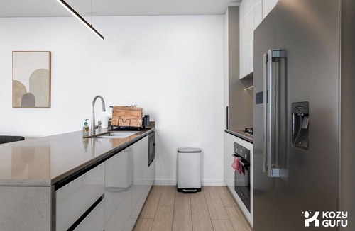 Lidcombe Apartment | KozyGuru | Lidcombe | Olympic Park Skyline Retreat