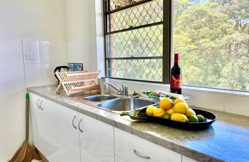 Nambucca Heads House | Nambucca rainforest retreat. Secluded - short walk to beaches, river and cafes.