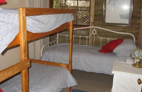 Carrickalinga House | Quaint Log Cabin Hidden Amongst The Trees