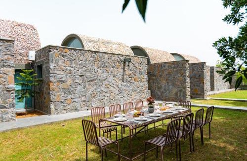 Rajawas Villa | Stone Age home 4-BHK Stone-Clad Villa with Private Pool, Terrace Garden & Gazebo