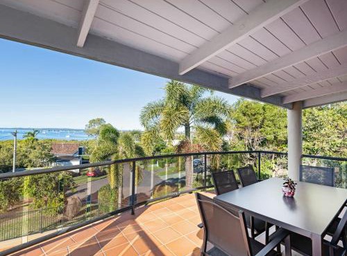Coastal Family Escape with Pool Balcony and Bay Views in Ormiston