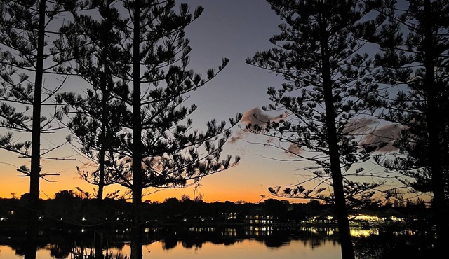 Reflections across the waters and resort access in Mudjimba