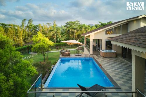 StayVista's The Tavern At Canary Farms - Mountain-View Luxury Mansion with Infinity Pool & Games Zone in Lonavala