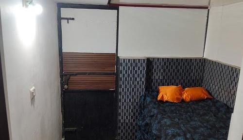 Single Bed in Dormitory Room