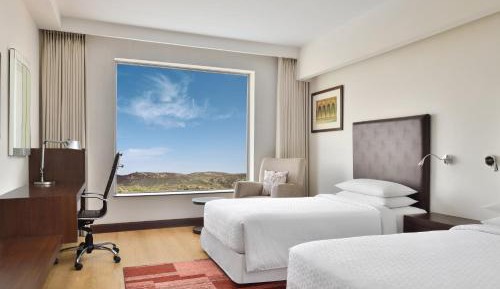 Deluxe Twin Room ( 20% Dis on SPA, Laundry and Food & Soft Beverages only at The Eatery, Credit Meal of INR 1000/- in a the stay on Minimum bill amount of INR 2500/-)
