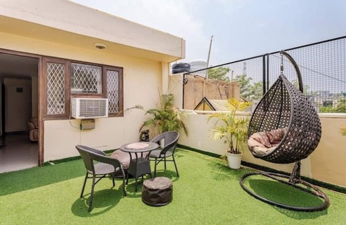 Chittaranjan Apartment | Cozy 2BHK with Private Terrace in GK1 – Walk to M Block Market!