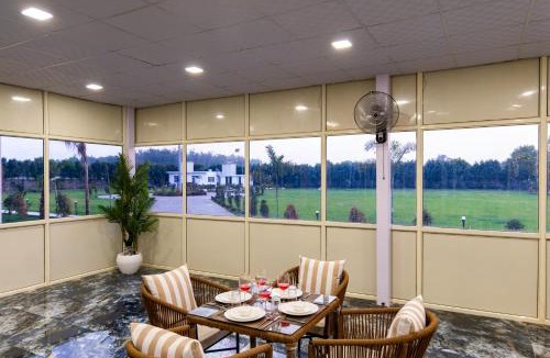 Faridabad Villa | Malik Farms Countryside Wooden Cottage on 2 Acre Estate with Shared Pool, Garden & Restaurant