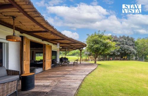 Indore Villa | StayVista's Water Song Garden - Lake-Side, Pet-Friendly Villa with Bar, Spacious Lawn & Indoor-Outdoor Games